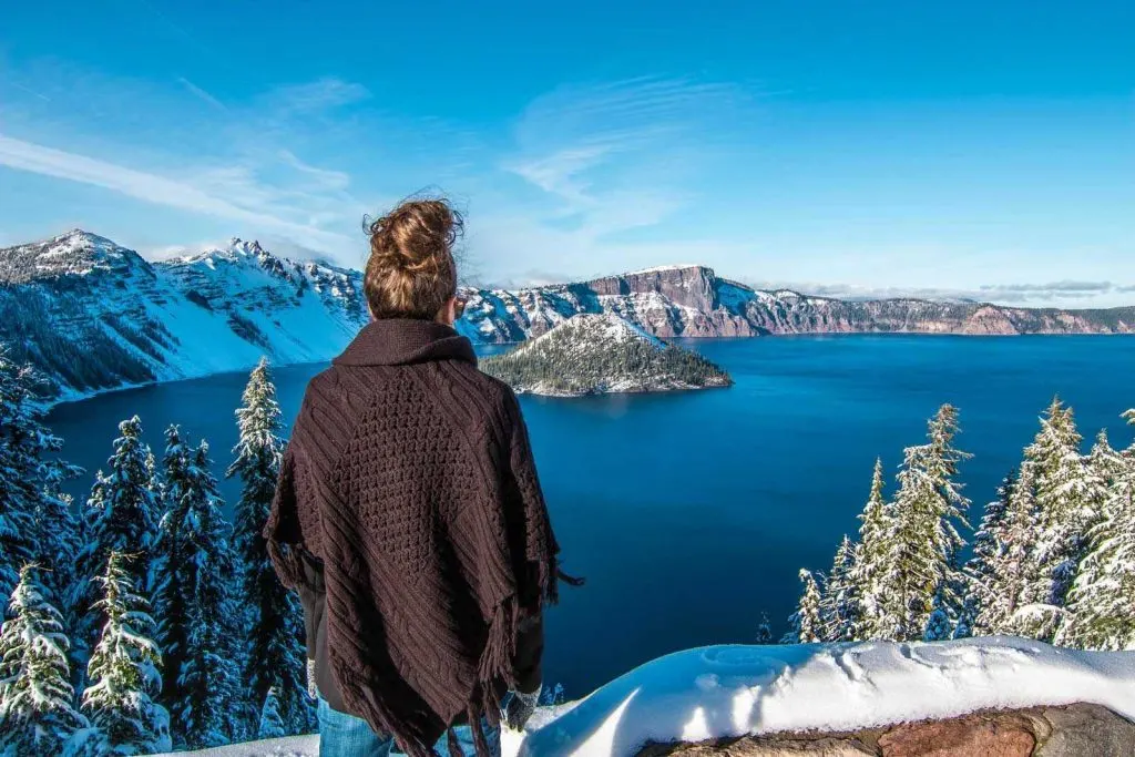 Nina looking out over Crater Lake in Winter