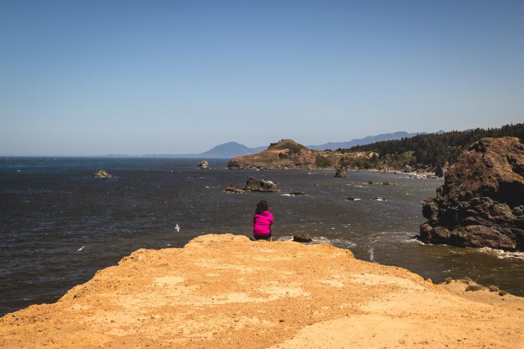 A woman stopped to rest on the Oregon Coast road trip.