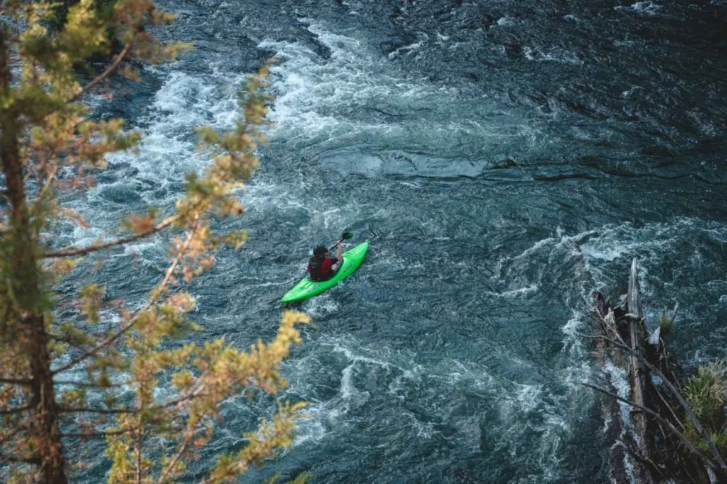 A view of people white water rafting on the Deschutes River — one of several exciting things to do in Bend