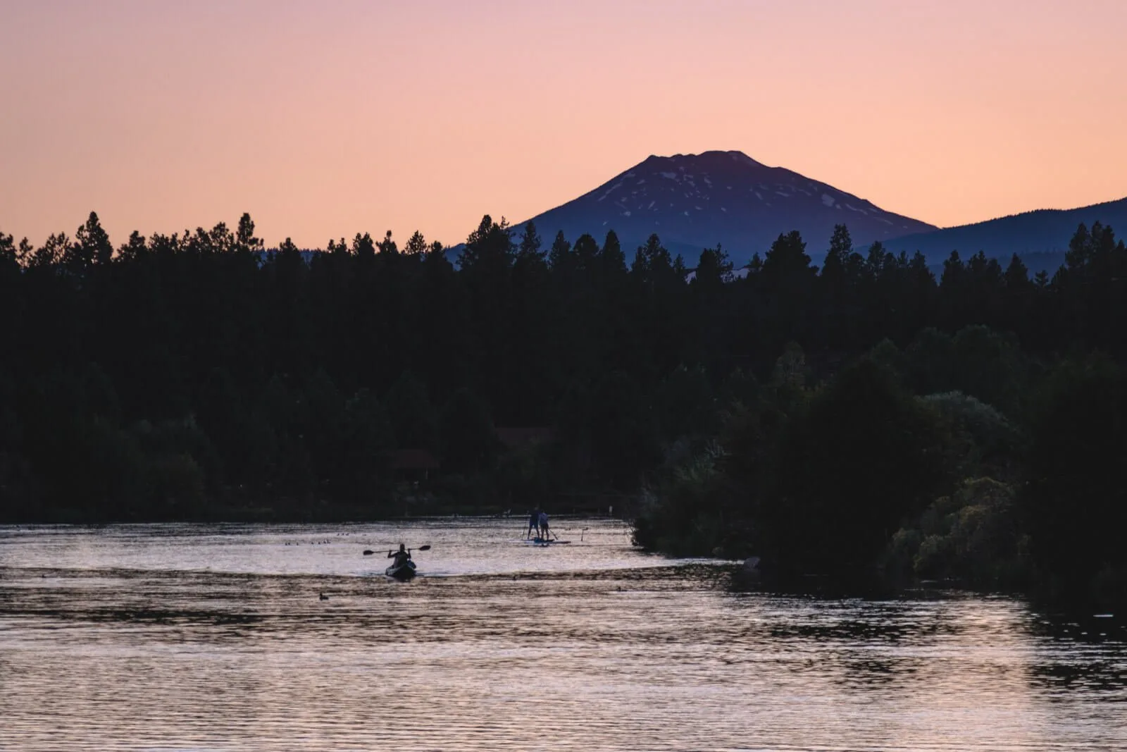Kayakers on the Deschutes River — add this to your list if you’re wondering what to do in Bend