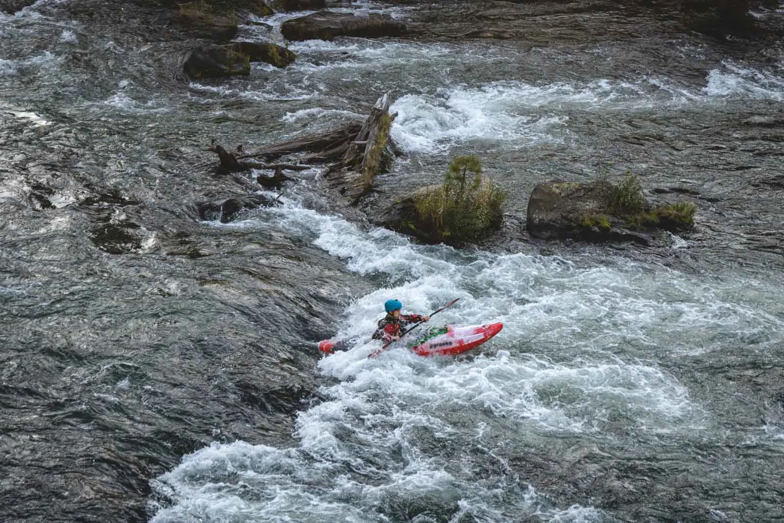 Kayaker on the Deschutes River — just one of the many beautiful things to do in Bend