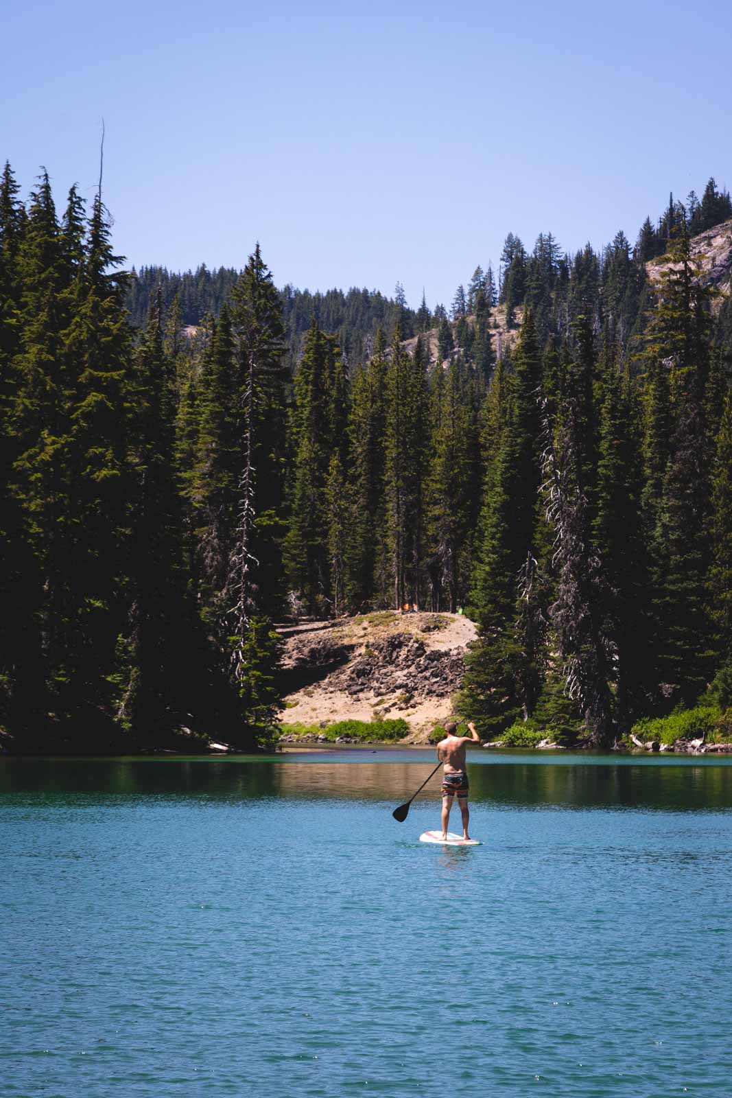 Paddle boarding is a fun activity to do in Devils Lake near Cascade Lakes.