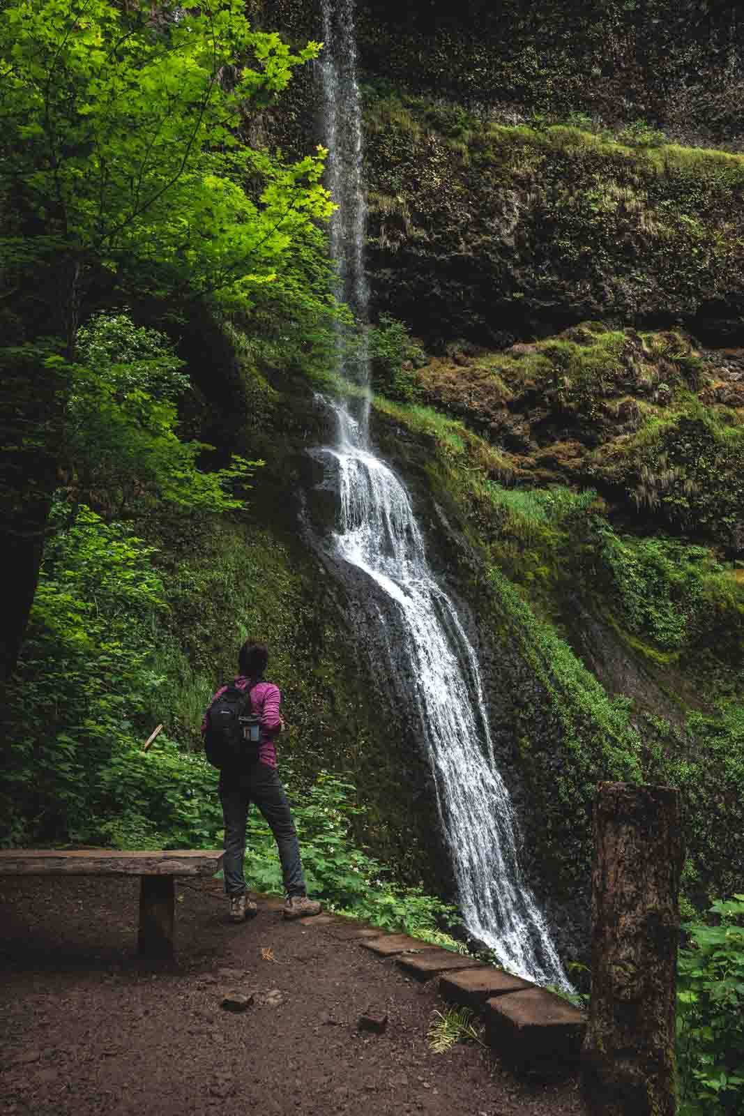 Winter Falls tumbling down with Nina standing to the side of it.