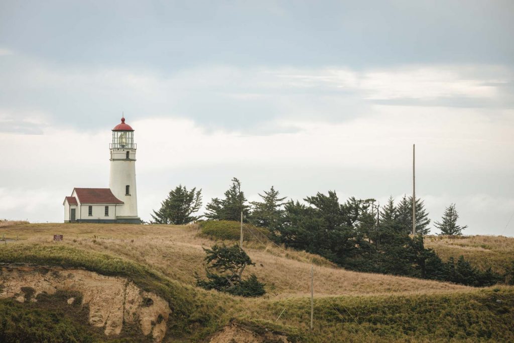 Lighthouse in distance at Cape Blanco Oregon Coast State Park