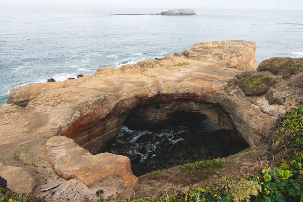 View over Devil's Punchbowl and the ocean, at Devil's Punch Bowl State Park - one of the Oregon Coast State Parks