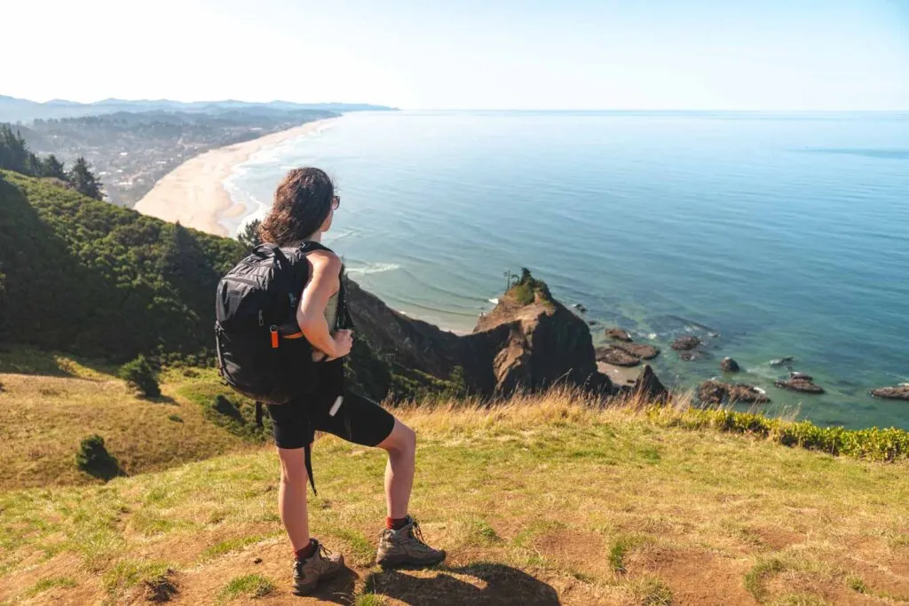 Woman looking out at view of ocean from God's Thumb hike