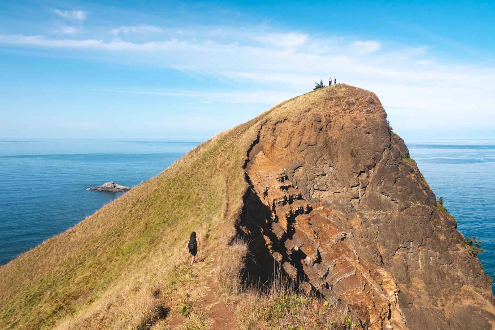 Nina walking up a trail to God's Thumb summit near Lincoln City.