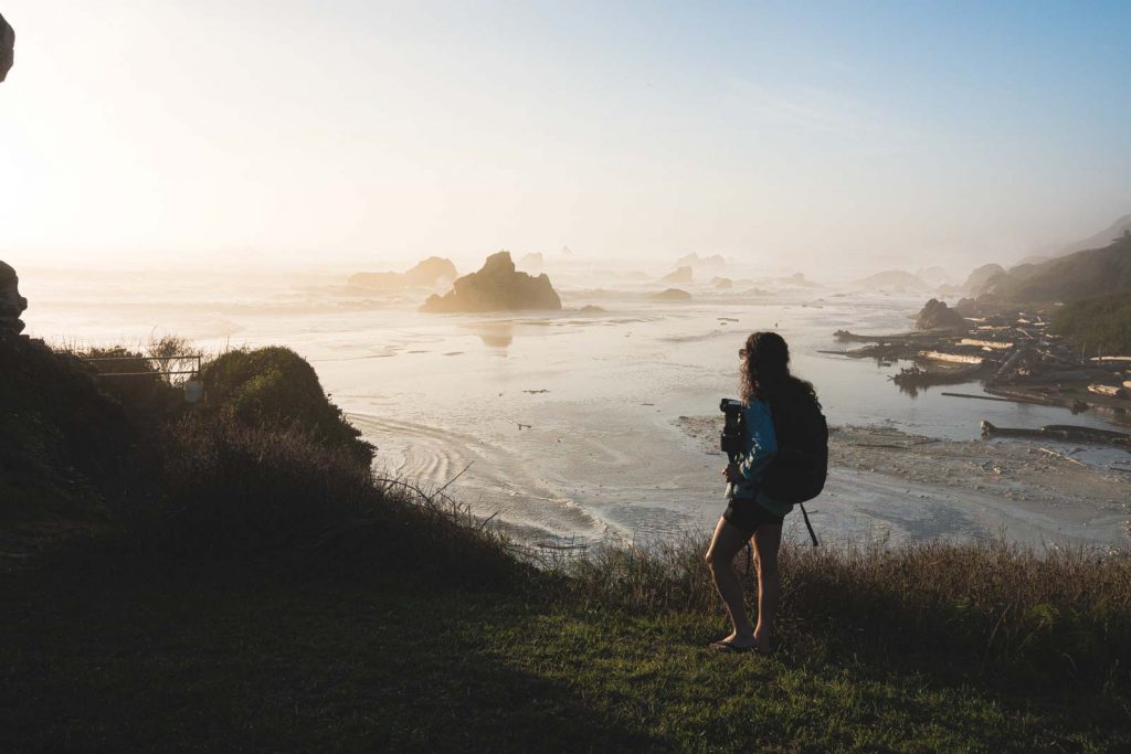 Woman looking out to see near Harris Beach in Oregon