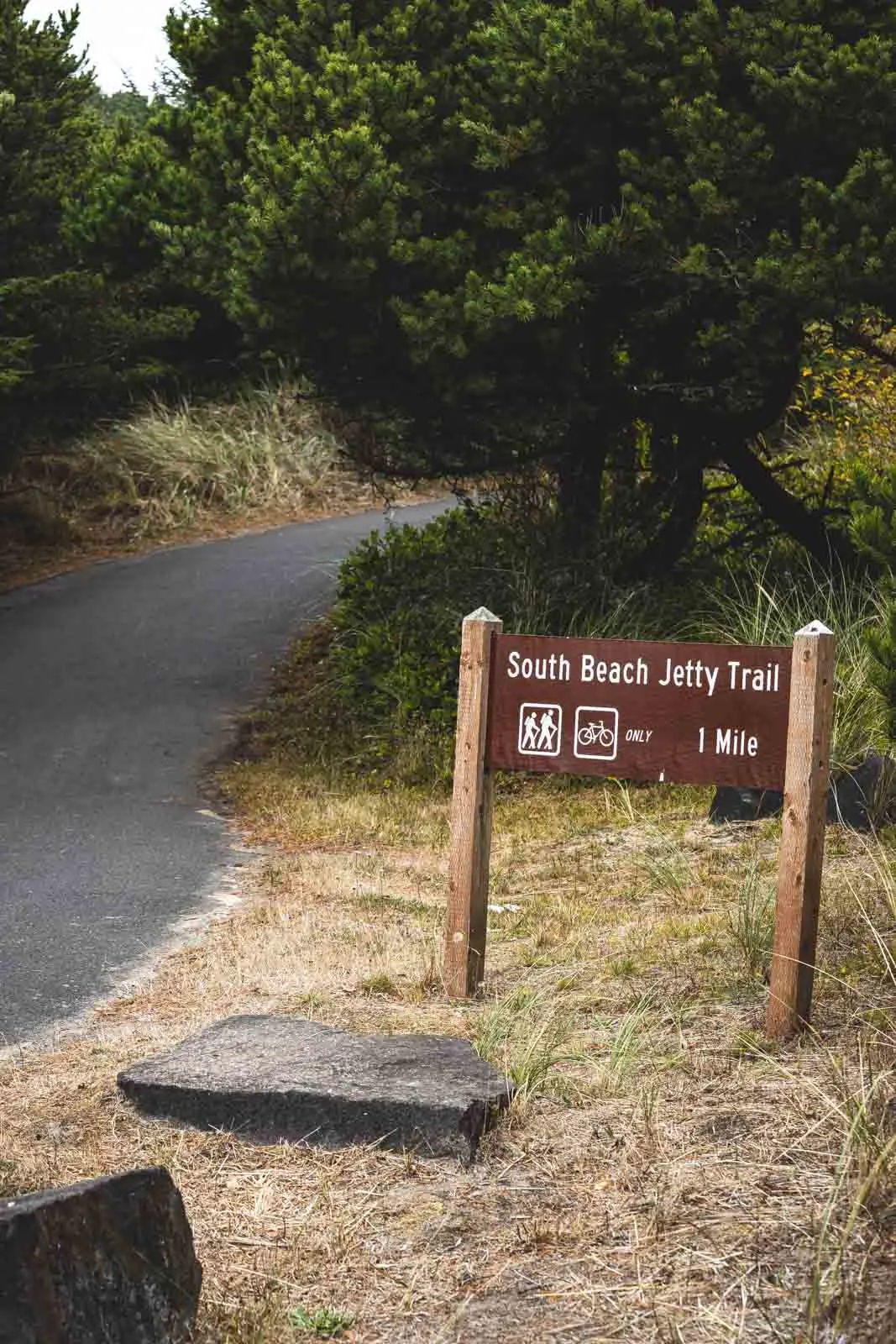 Sign for South Beach State Park by the road. Visit as part of an Oregon Lighthouses road trip