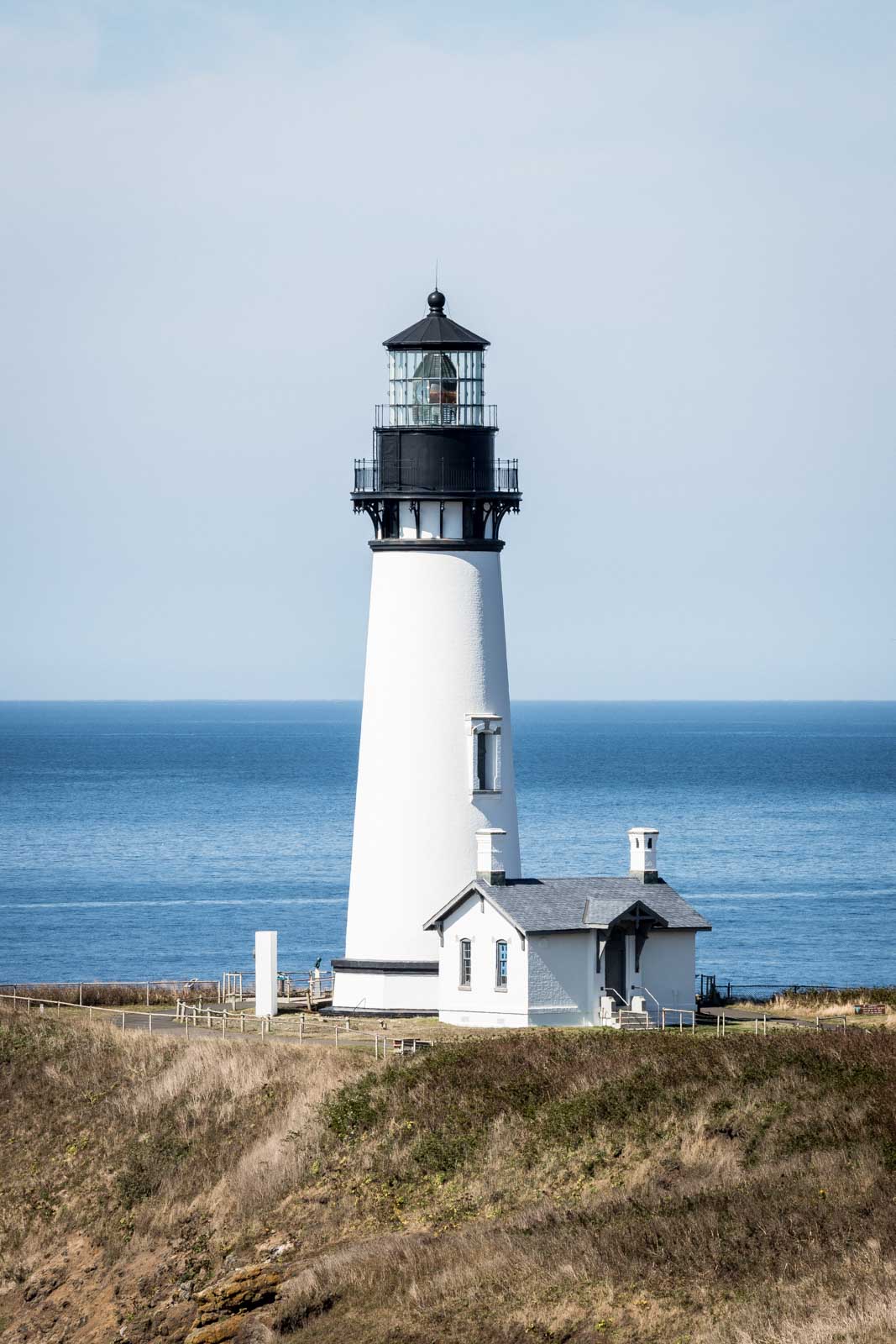 Yaquina Head Lighthouse with ocean in the background in Oregon