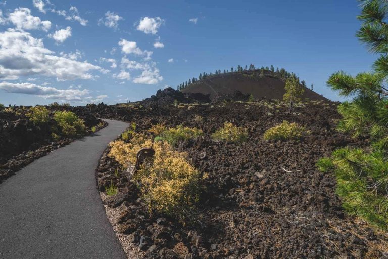 Trail through old lava on the Big Obsidian Flow Hike in New berry National Volcanic Monument