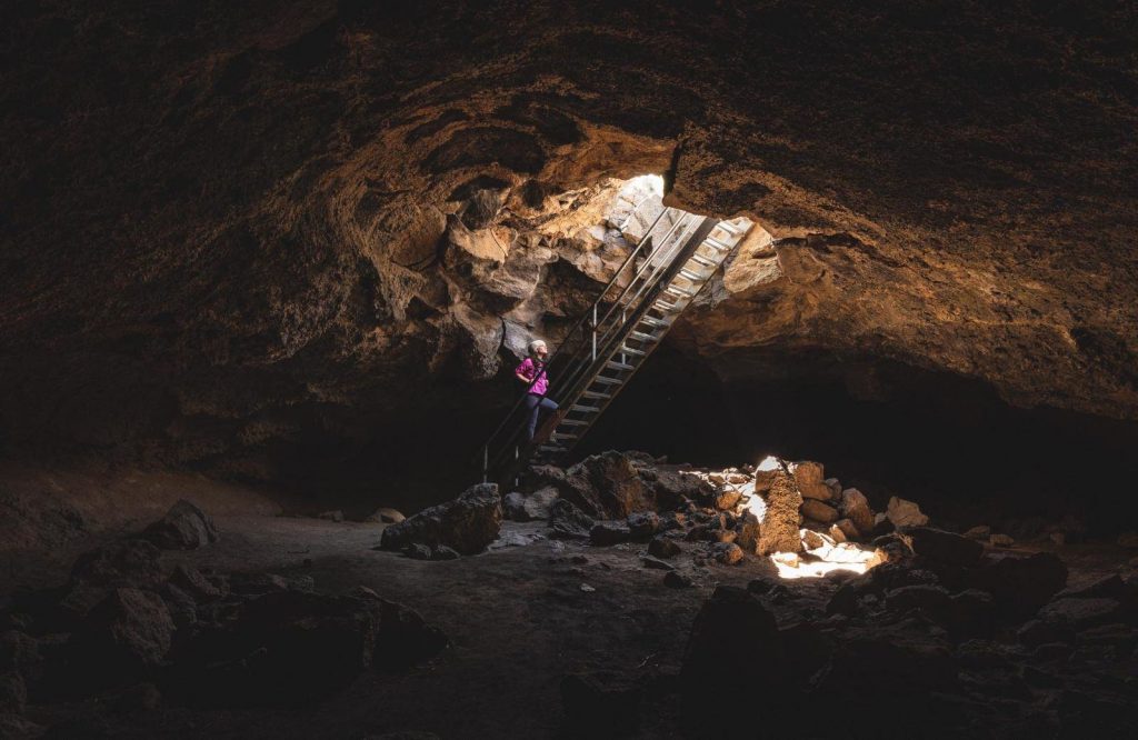 Person by stairs in Boyd Cave near Newberry National Volcanic Monument