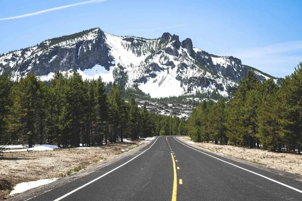 Road with view of forest and Paulina Peak in Newberry National Volcanic Monument