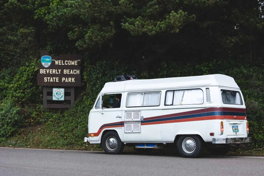 VW van beside sign for Beverly Beach State Park