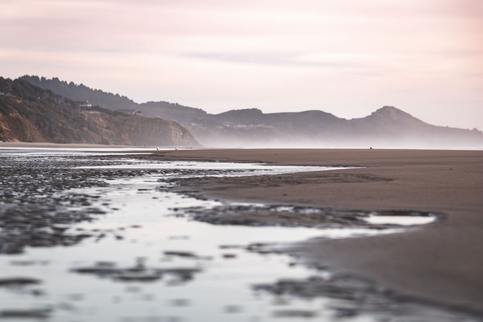 Down low picture of Beverly Beach with hills in the back.