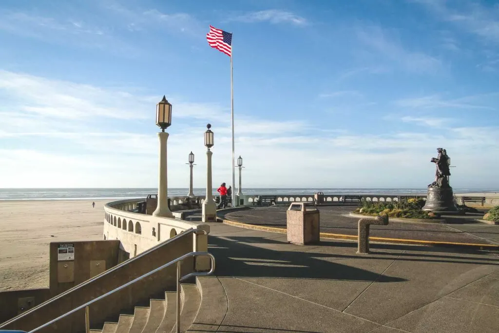 American flag and lamp posts on beach promenade in Seaside, Oregon Coast Town