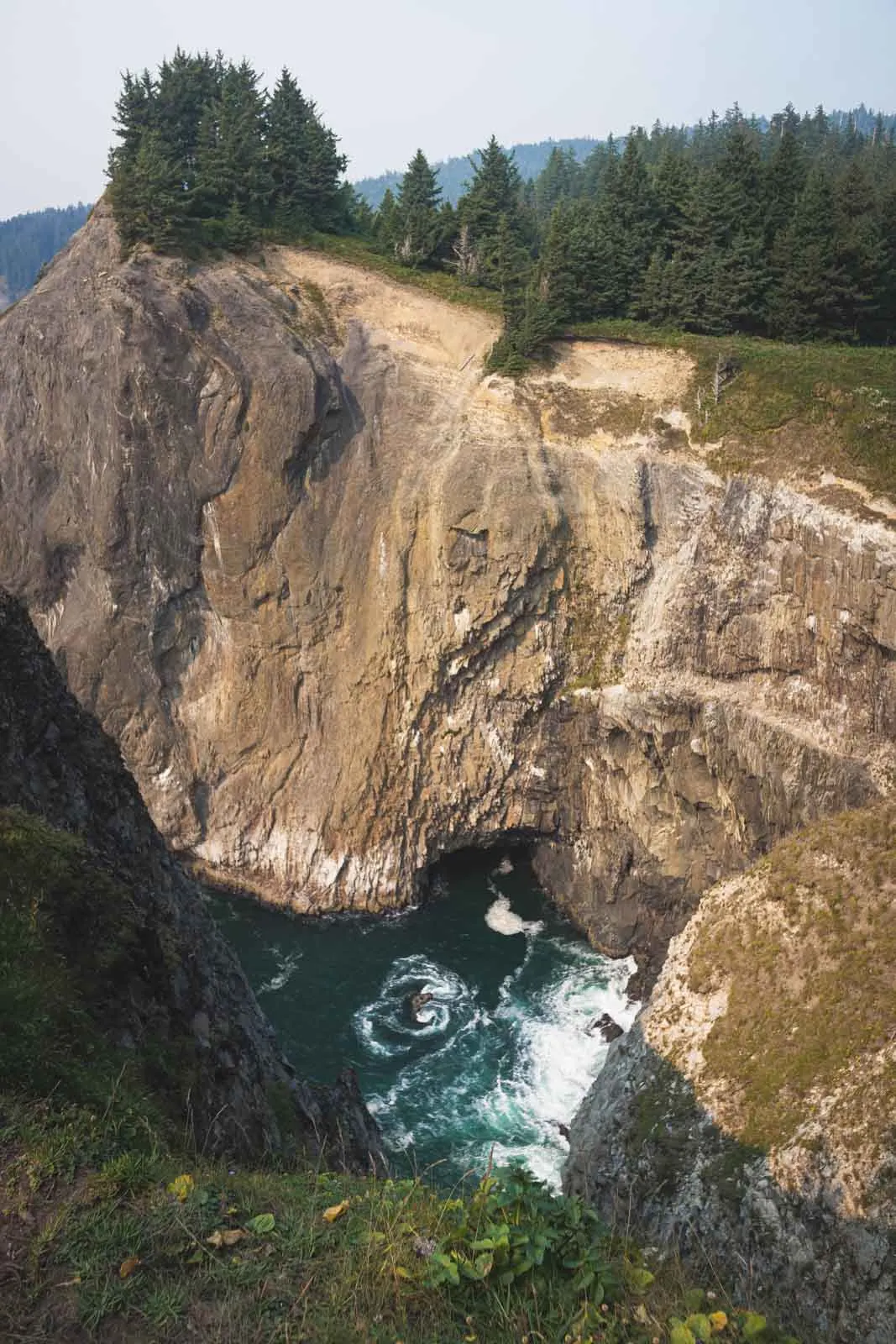 View of Devil's Cauldron on the Oregon Coast from above in Oswald West State Park