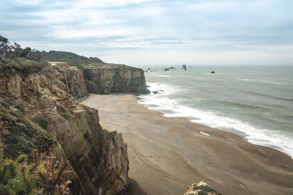 View over beach, sea cliffs and ocean at Flores Lake State Park near Bandon Beach