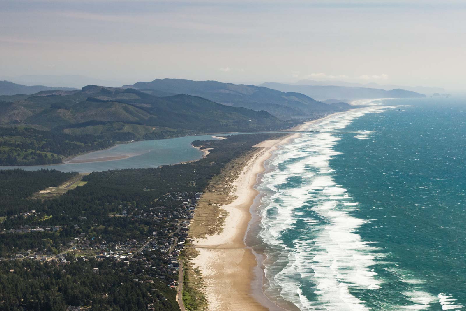 View over beach, ocean and coast from Neahkahnie Mountain in Oswald West State Park.