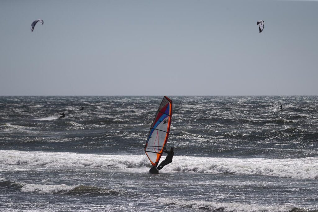 Windsurfer surfing waves at Pistol River near Gold Beach