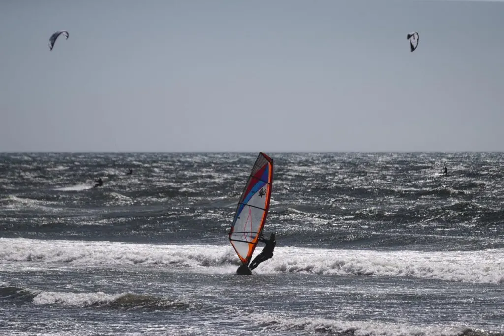 Windsurfer surfing waves at Pistol River near Gold Beach