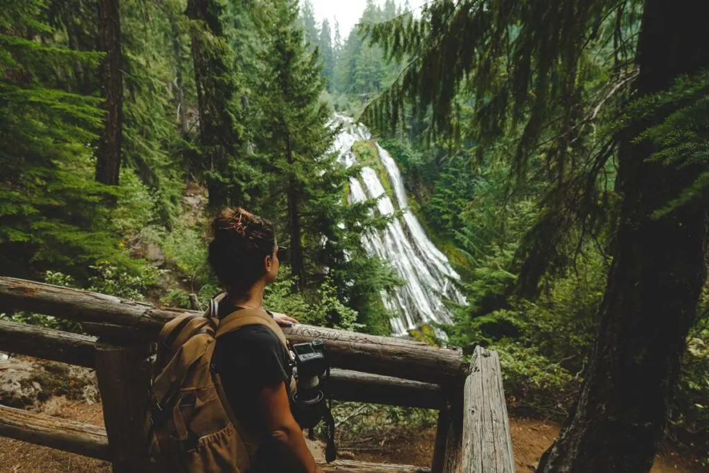 Woman at Diamond Creek Falls viewpoint, Oregon