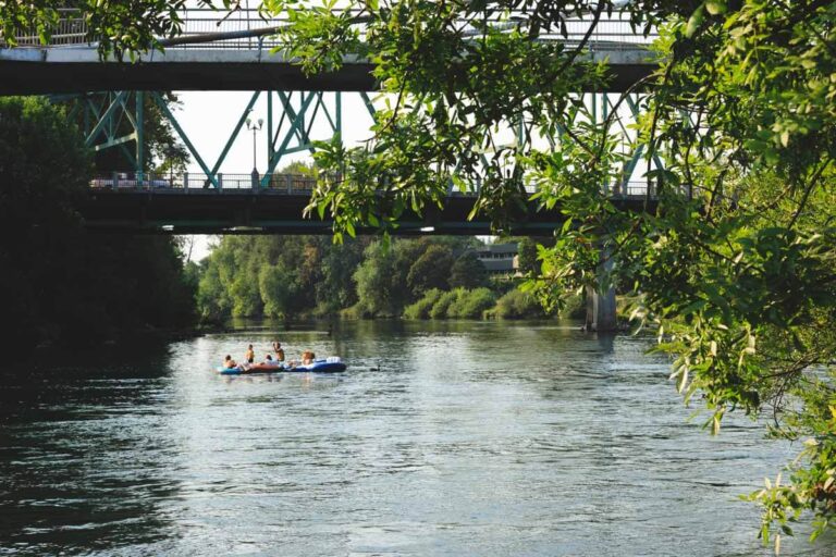 River floaters under bridge in Alton Baker Park things to do in Eugene, Oregon