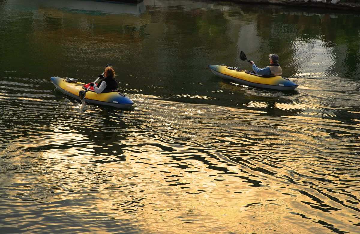 Two people kayaking Ecola creek.