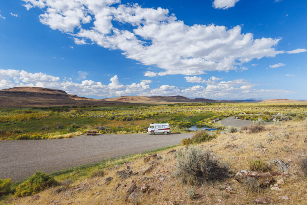 Campervan in desert scenery at Willow Creek Hot Springs