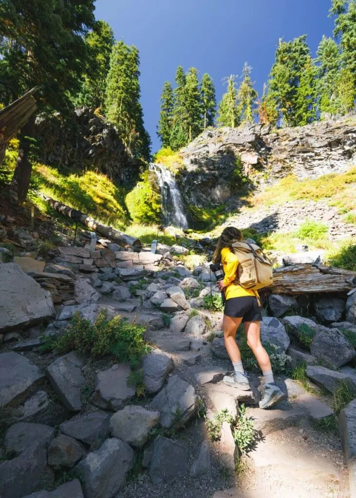 Hiker on Plaikni Falls Trail on the Crater Lake Rim Drive Hiker on Plaikni Falls Trail on the Crater Lake Rim Drive