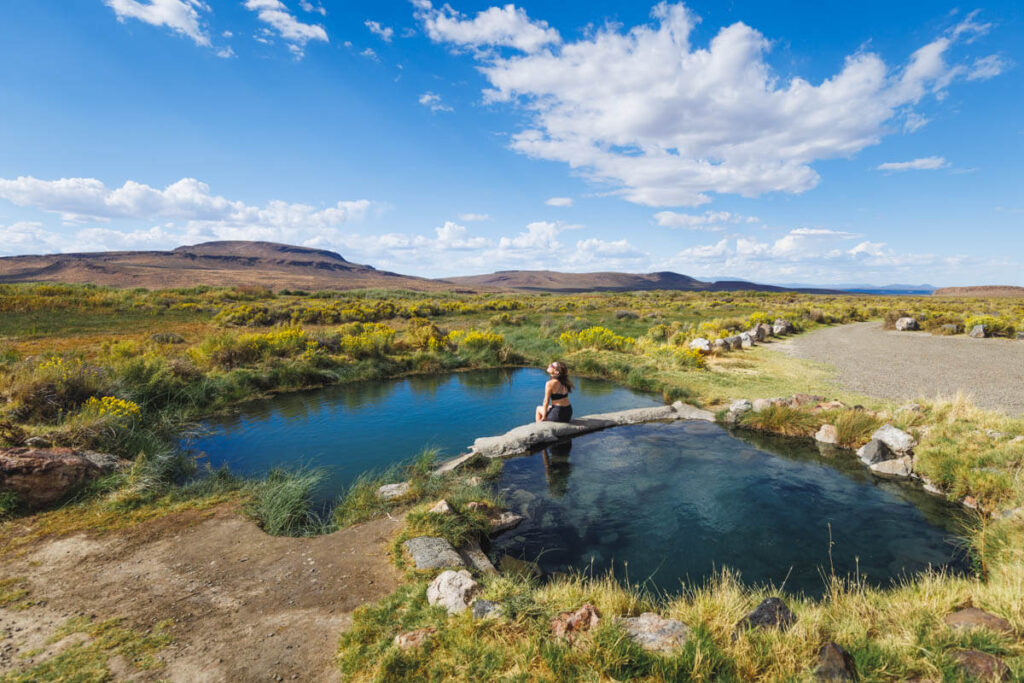 Woman sitting in Willow Creek Hot Springs