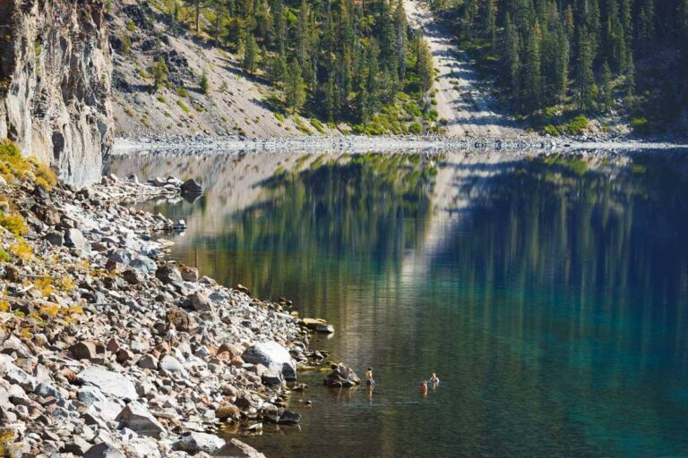 People swimming in Crater Lake off the Cleetwood Cove Trail