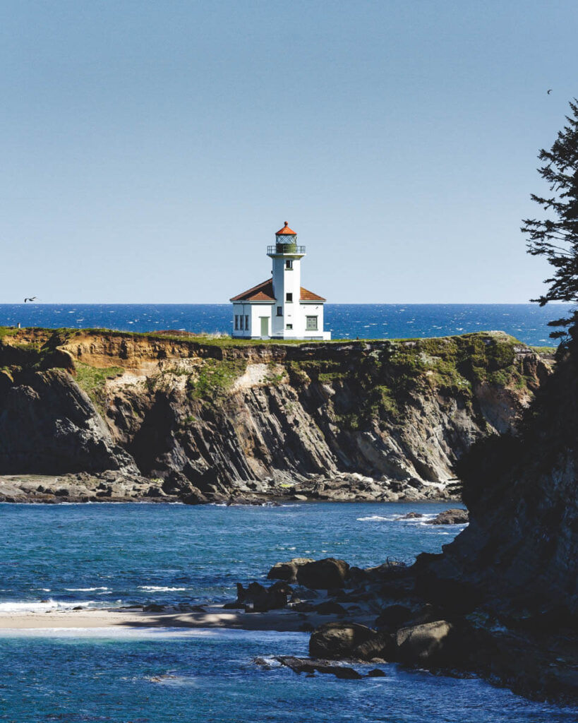 Cape Arago Lighthouse on the rocky cliffs of the Oregon Coast.