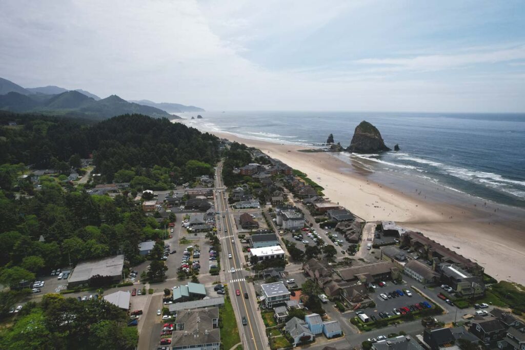 Aerial of Cannon Beach, Haystack Rock and the surrounding beachside town.
