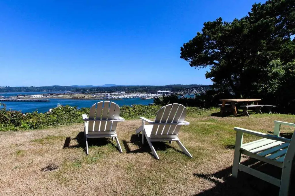 Two deck chairs facing the ocean view in the Arden Cottage.