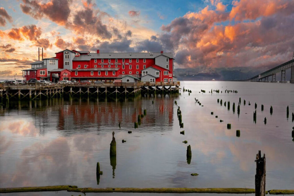 A beautiful red and orange sunset over the Cannery Pier Hotel and Spa in Astoria.