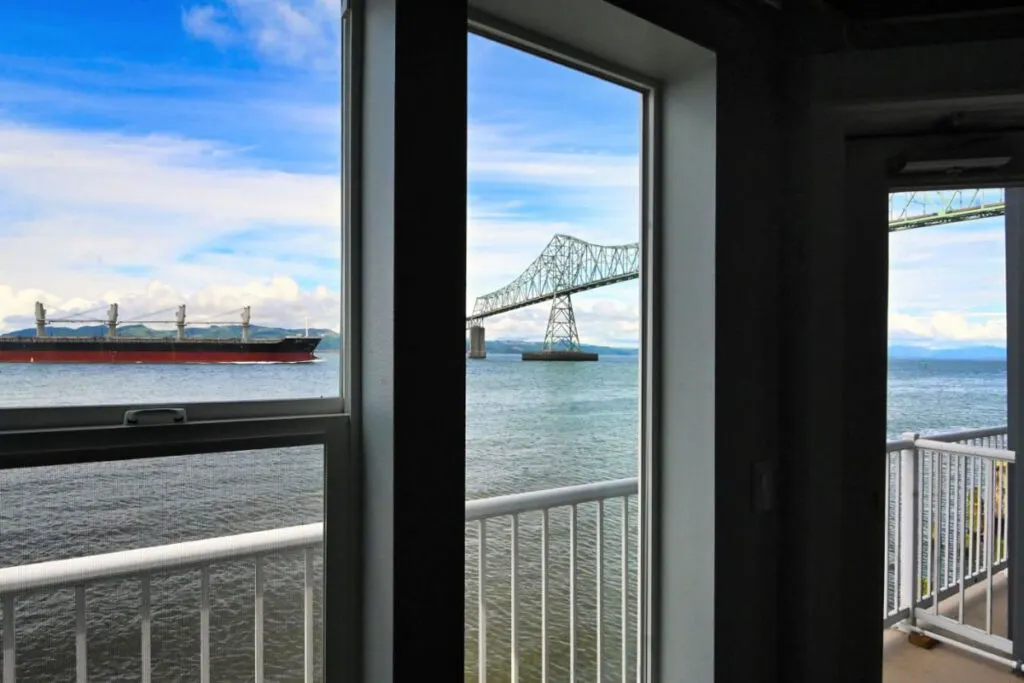 The view of a cargo ships passing under a nearby steel bridge seeing from the window of one of the rooms at the Cannery Pier Hotel and Spa. The view of a cargo ships passing under a nearby steel bridge seeing from the window of one of the rooms at the Cannery Pier Hotel and Spa.