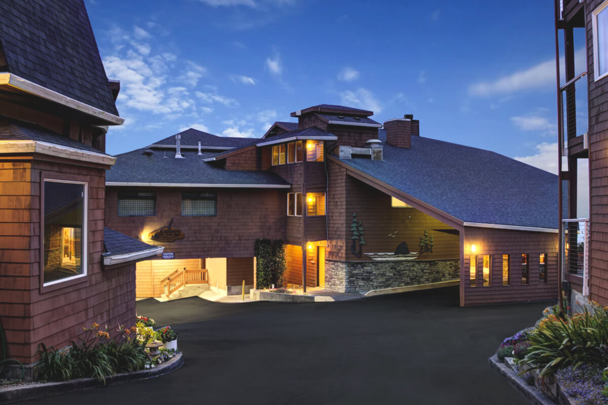 The exterior of Hallmark Resort and Spa at blue hour.