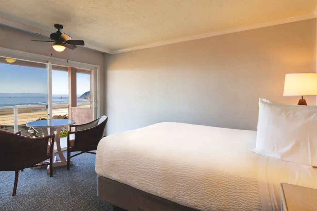 A spacial queen room with a view of Cannon Beach at Hallmark Resort and Spa.