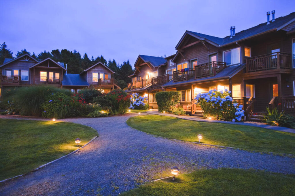 The exterior of The Inn at Cannon Beach at blue hour.