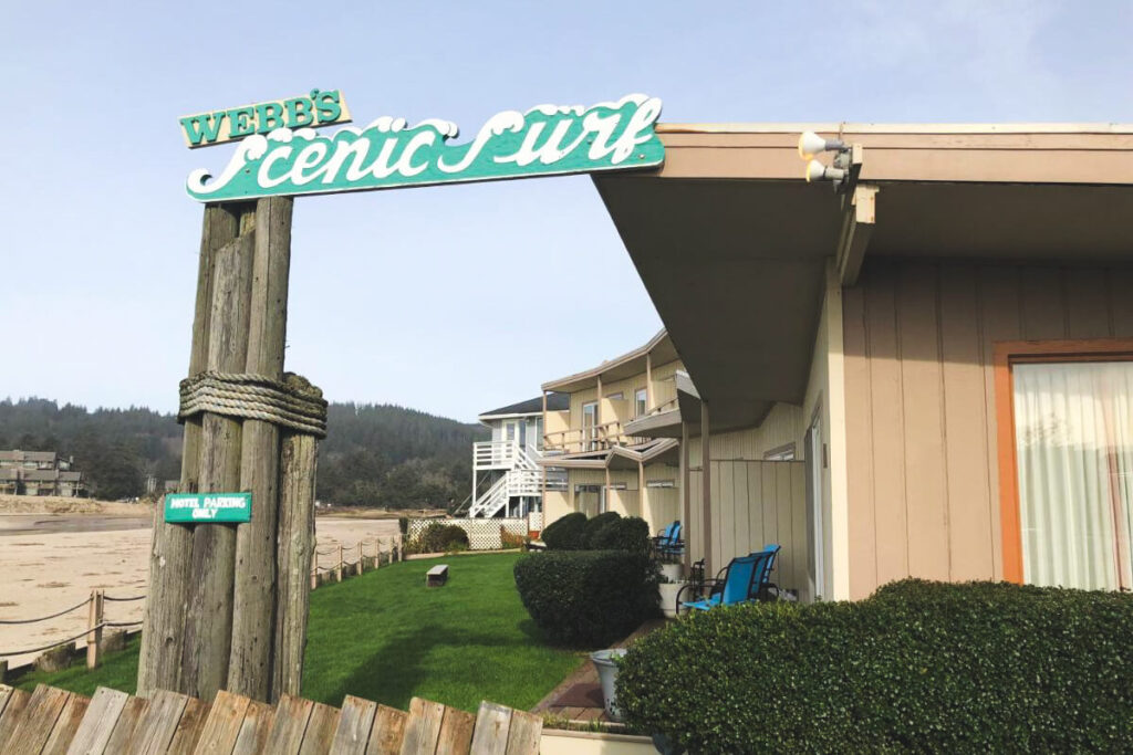 The sign and exterior of Webbs Scenic Surf Resort right next to Cannon Beach.