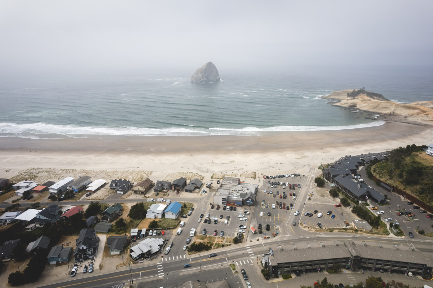 Aerial view over Pacific City Beach in Oregon on a misty day.