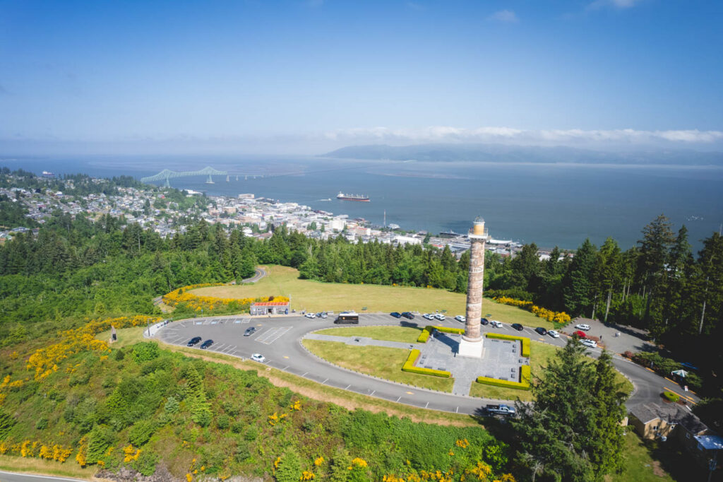 Aerial view of Astoria Column on a hill over Astoria Town.