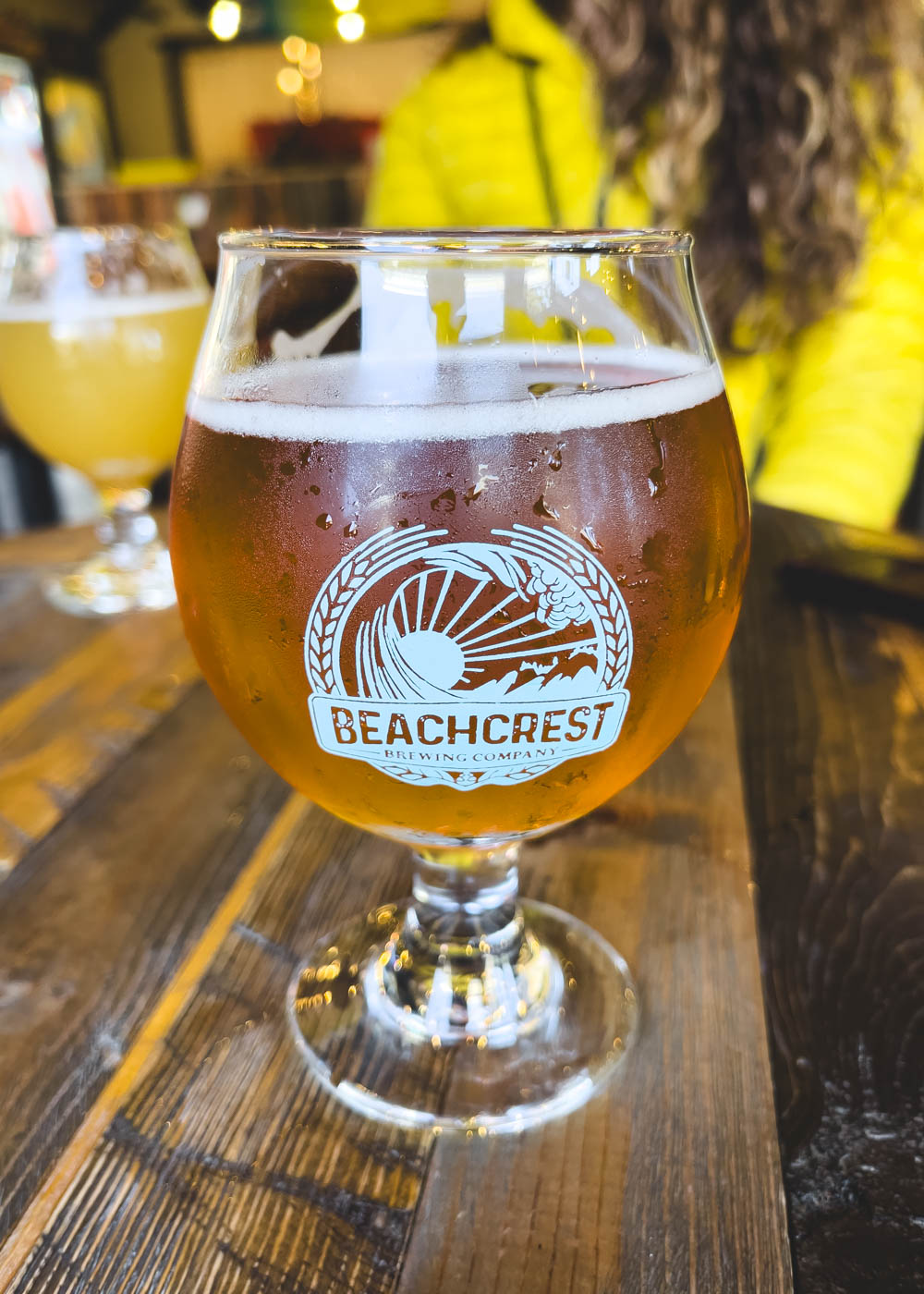 A fill beer glass on a table at Beachcrest Brewing in Lincoln City.
