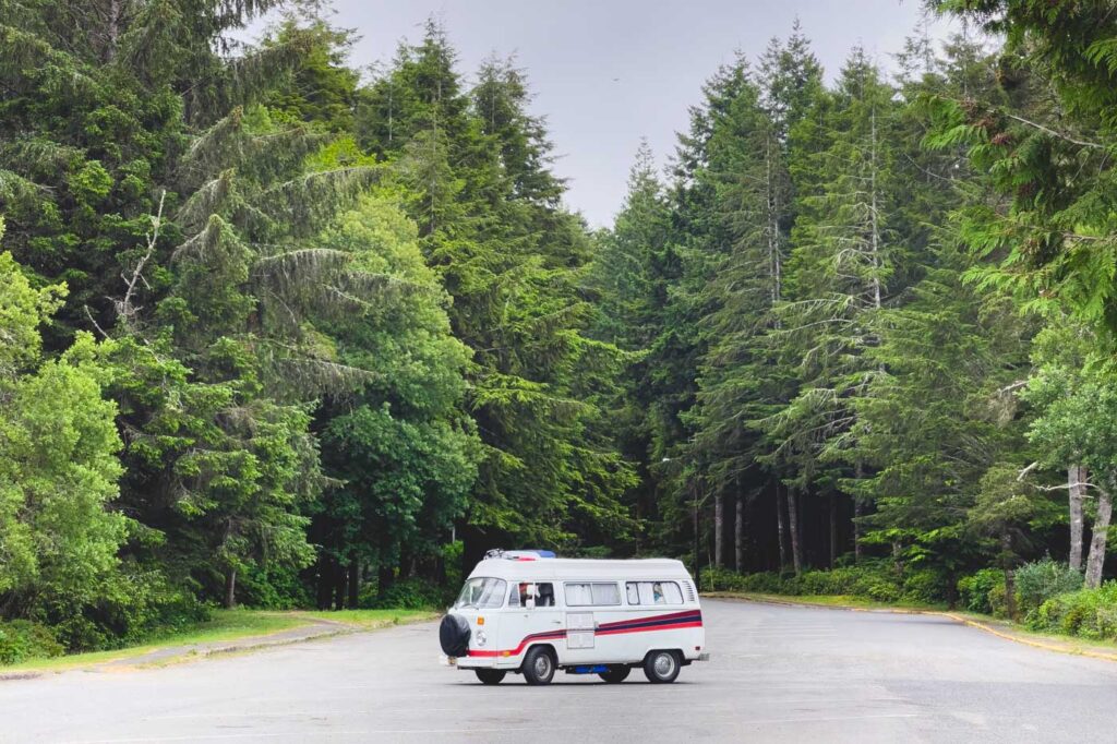 Campervan surrounded by trees along a road in East Devil's Lake State Recreation Area.