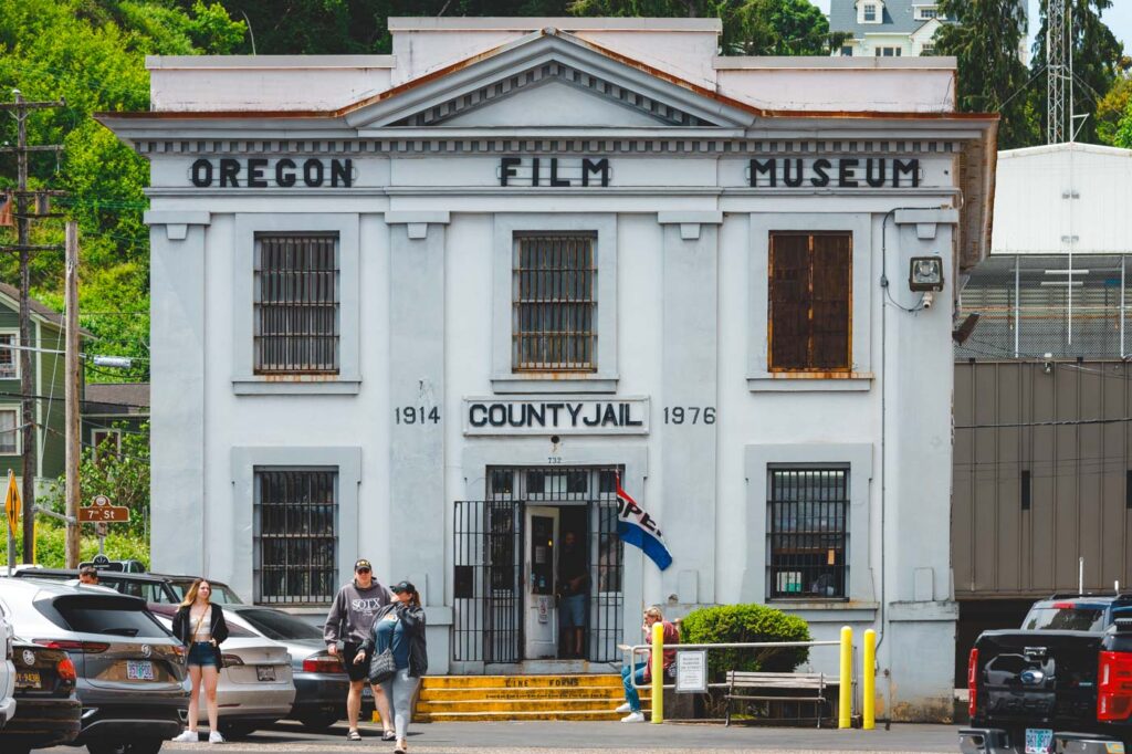 People exiting the old building of Oregon Film Museum in Astoria.