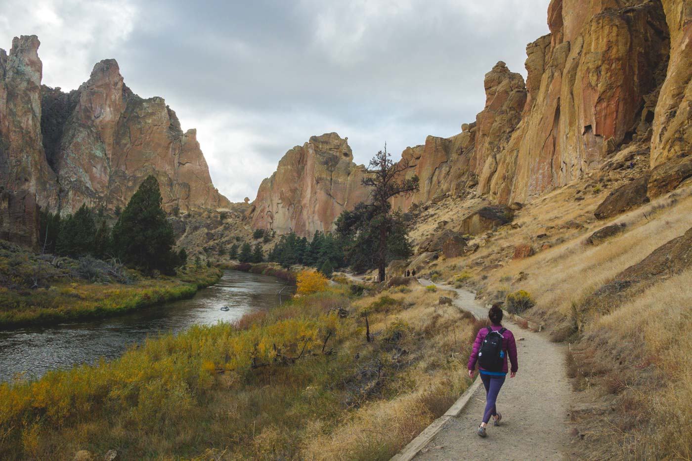 Hiker on the River Trail along the Crooked River canyon at Smith Rock State Park