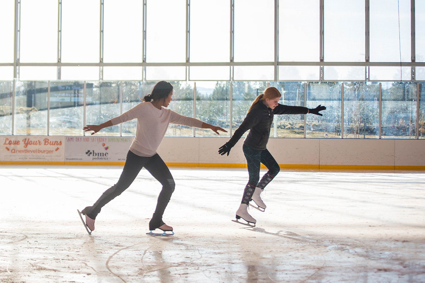 A young girl taking private skate lessons at the Pavilion in Bend.