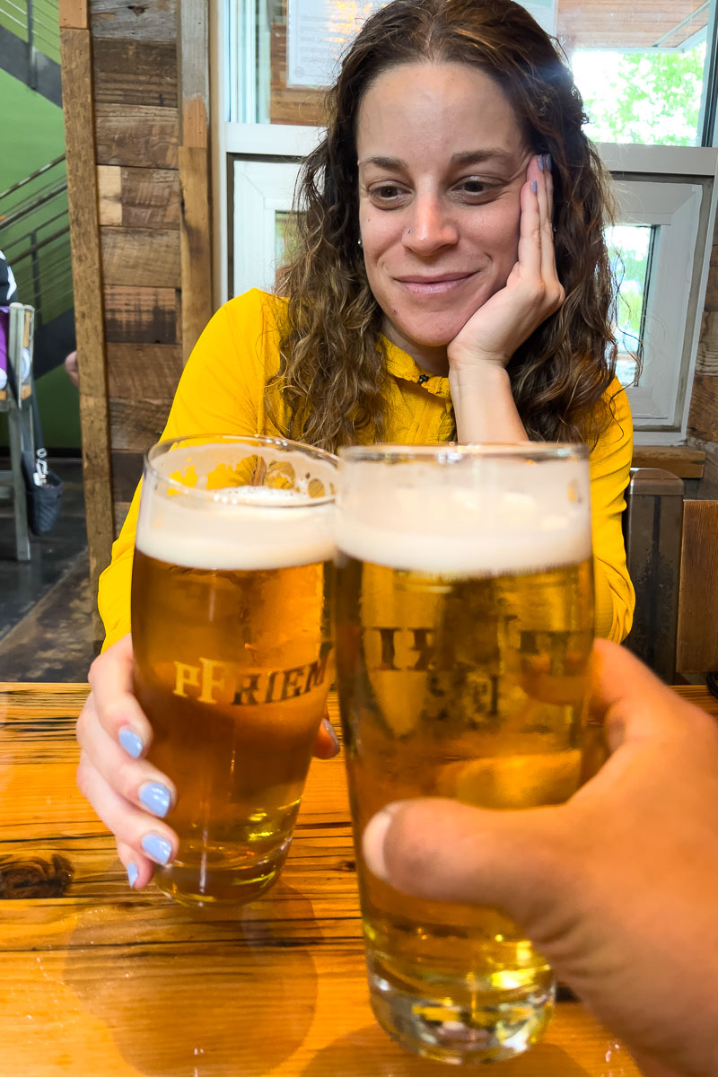 pFriem brewery Nina nd garrett cheersing beers.