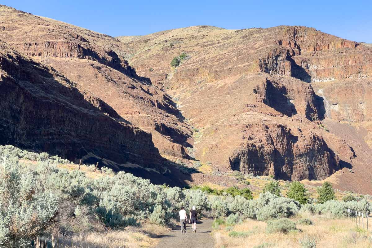 Cottonwood Canyon State Park pinnacles trail with two people walking.